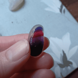 multi coloured sea glass on white background